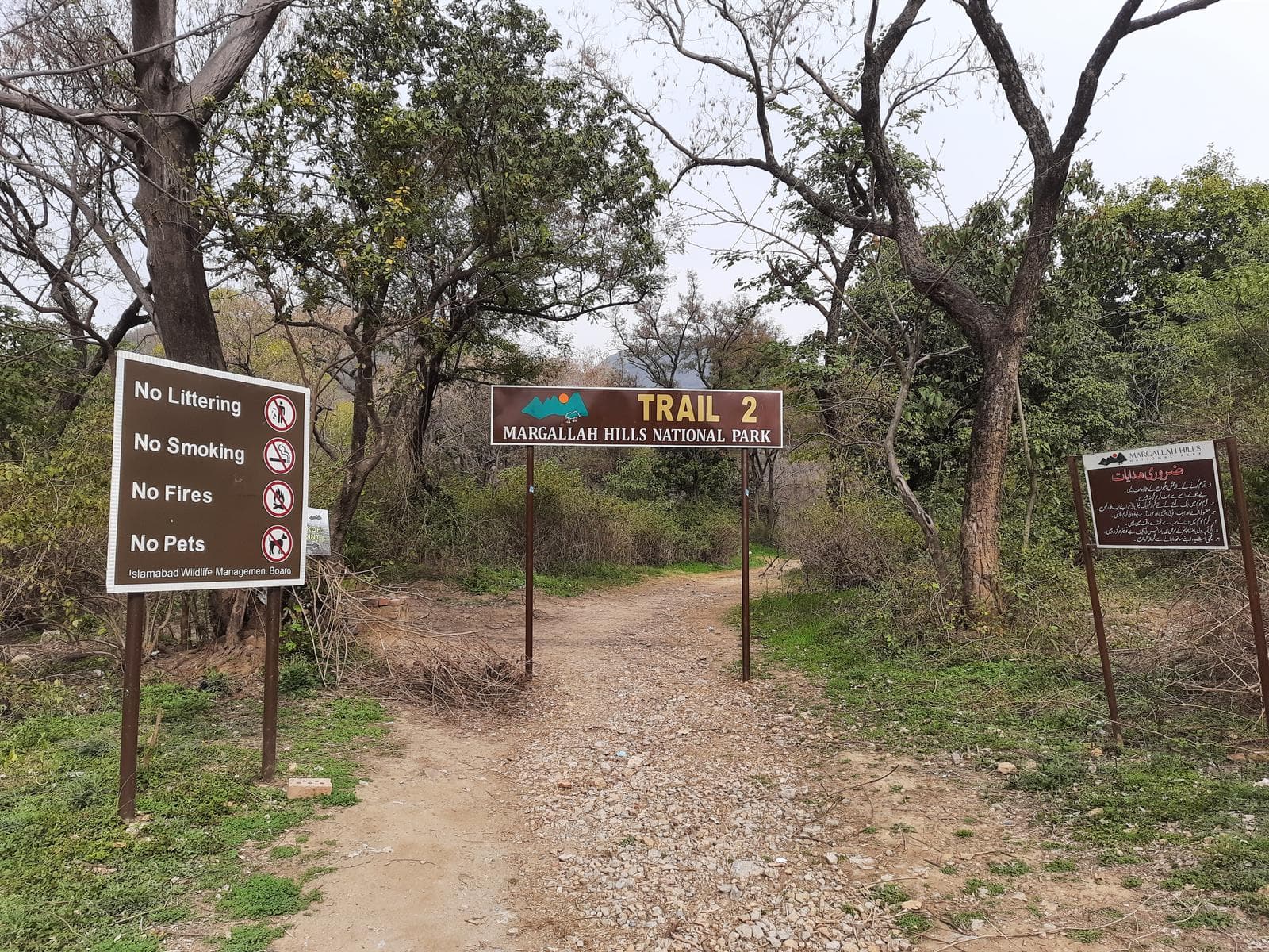 The Trail 2 trailhead, with the Islamabad Wildlife Management Board's rules board beside it.